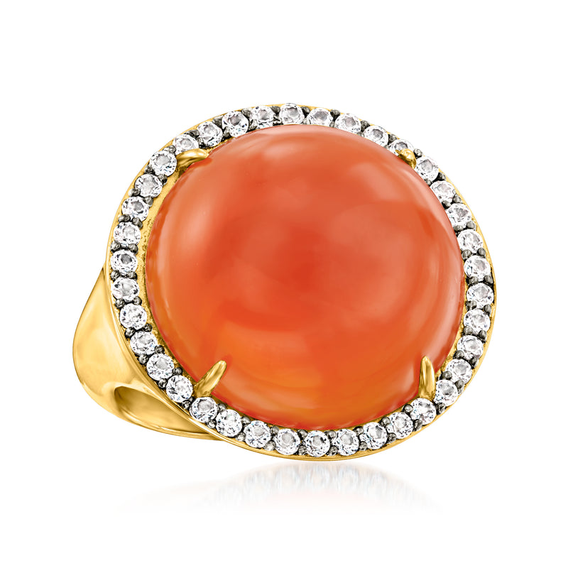 Gold over sterling ring with orange oval cabochon and white stone halo