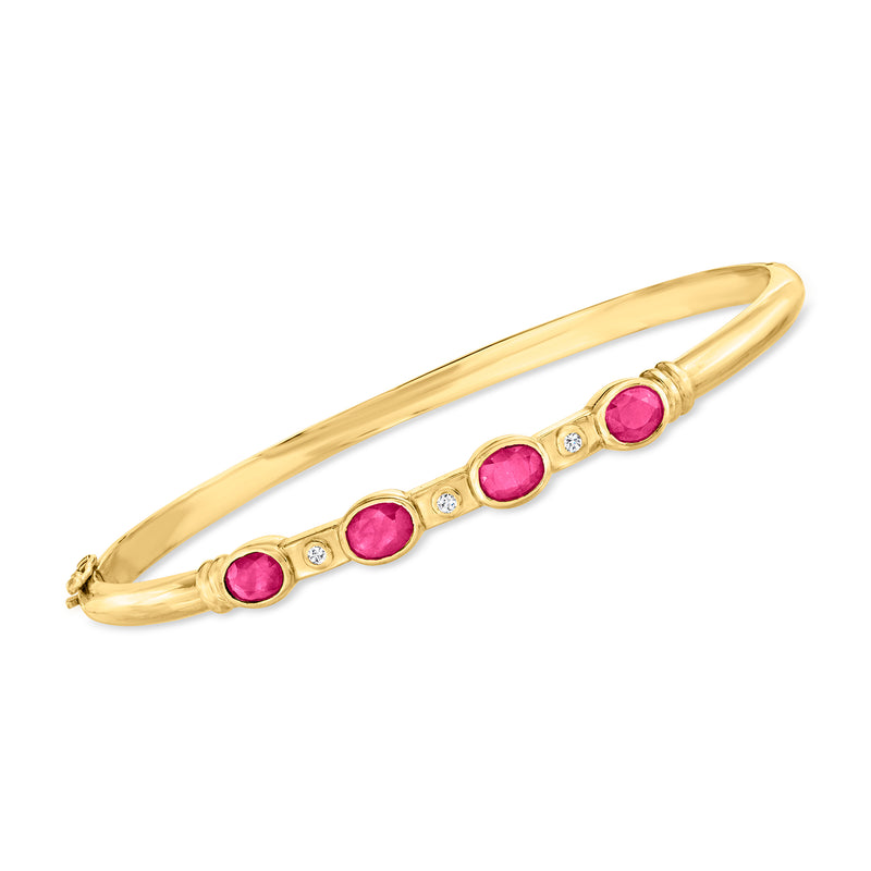 18kt yellow gold bangle bracelet with oval ruby stones and small diamond accents