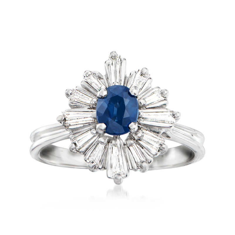 Vintage platinum cocktail ring with blue sapphire center and diamond burst halo