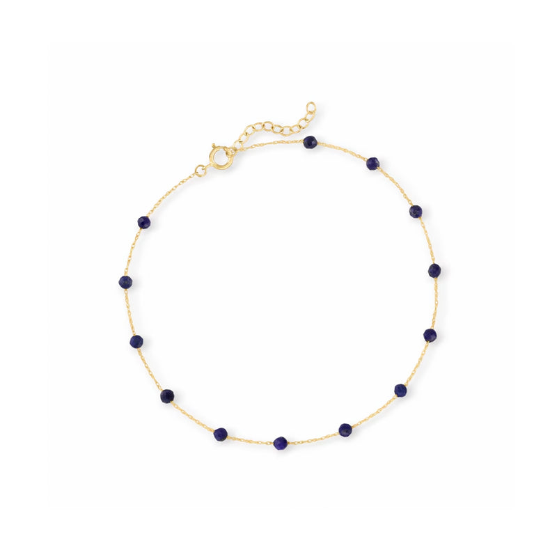 Yellow gold anklet with lapis-blue bead stations and spring-ring clasp