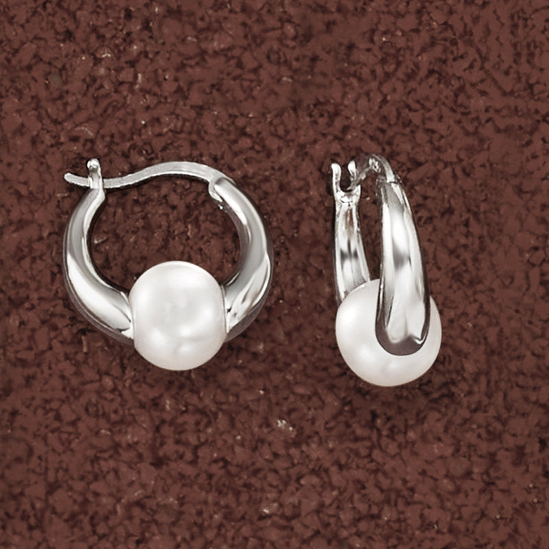 Sterling silver huggie hoop earrings with white cultured pearl, side profile