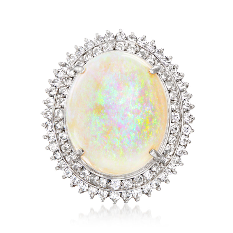 Platinum ring with oval opal center and diamond halo, prong-set stones