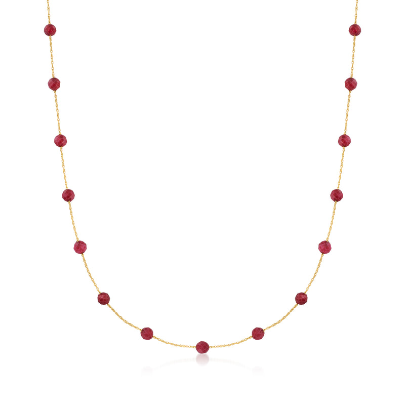 10kt yellow gold ruby bead station necklace with round red beads on gold chain.