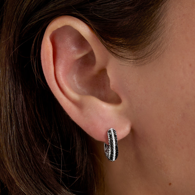 Diamond huggie hoop earring in sterling silver, black and white stones on band