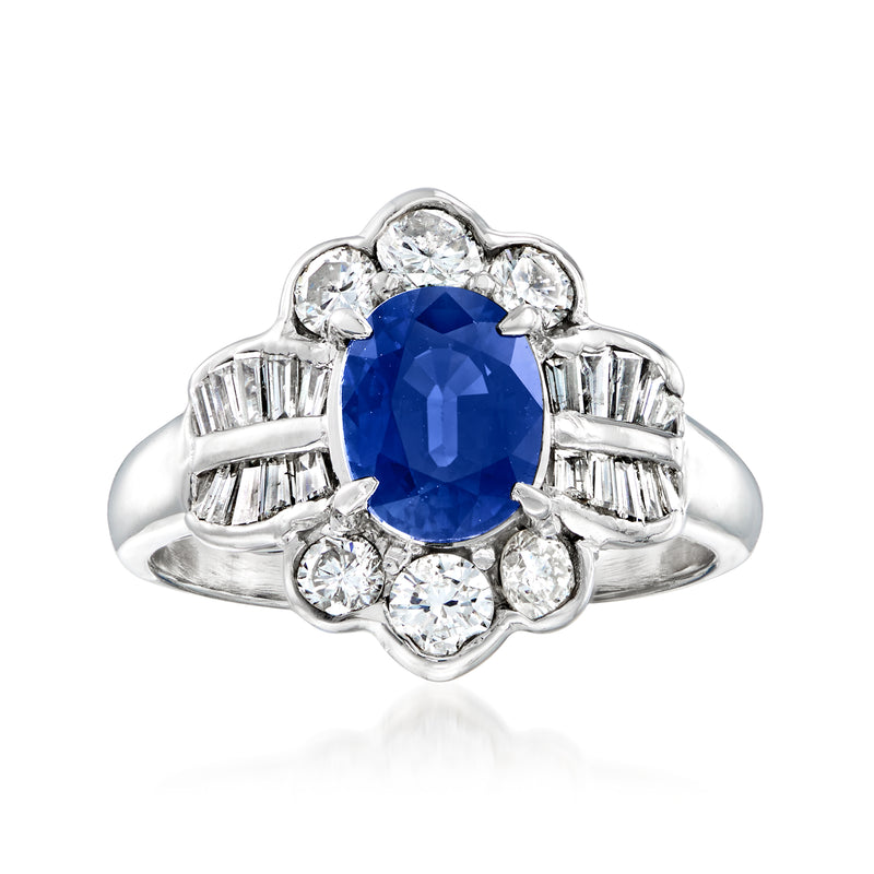 Platinum vintage-style dinner ring with oval sapphire center and diamond halo