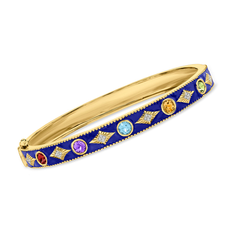 Gold-tone bangle with blue enamel and multicolor gemstones, diamond-like accents.