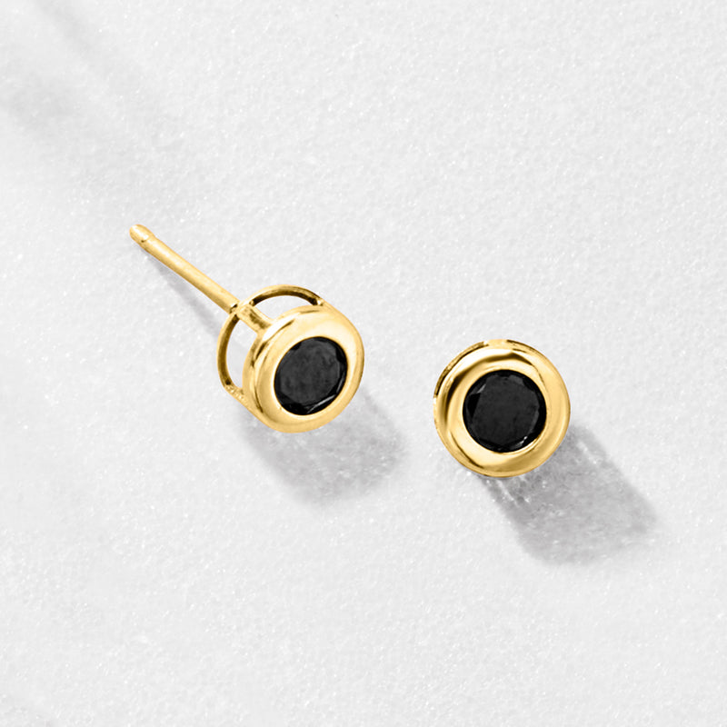 Round black onyx stud earrings in 10kt yellow gold, bezel-set posts