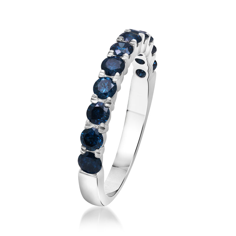 Sterling silver ring with blue round diamonds along the band, side view