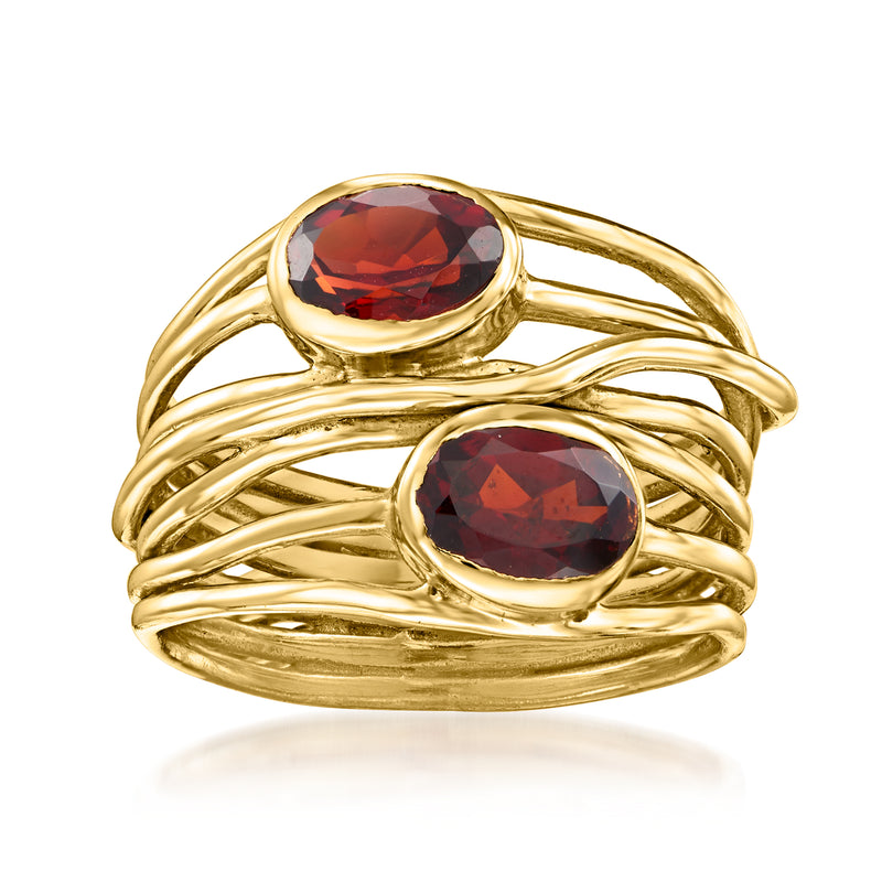 Gold over sterling garnet highway ring with two oval red stones and openwork band