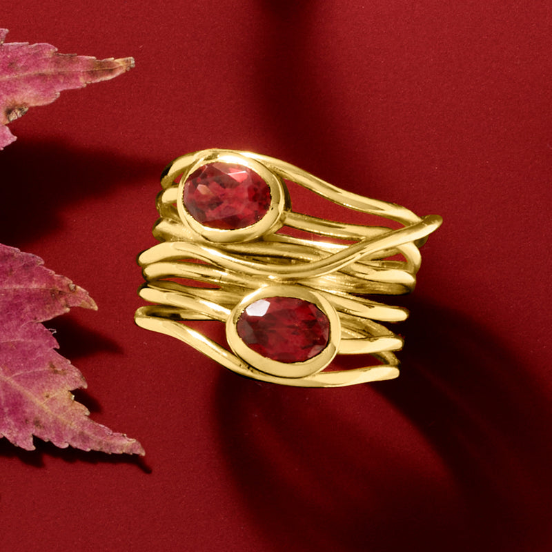 Gold over sterling garnet highway ring with two oval red stones and rope-like band