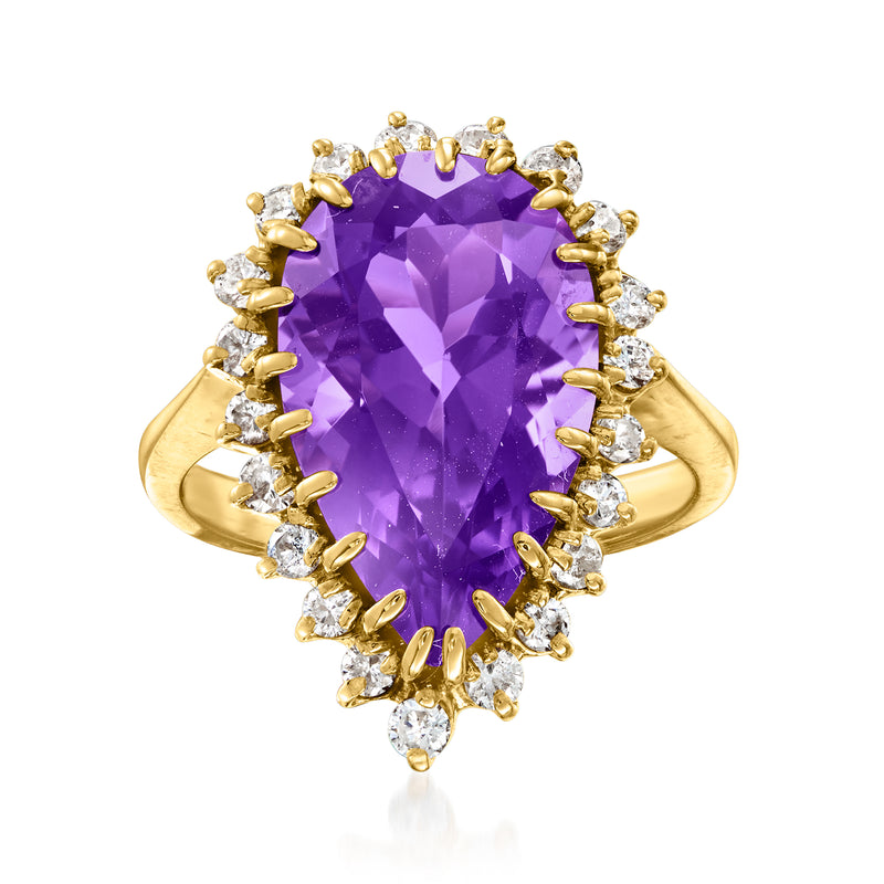 Amethyst and diamond halo ring in 14kt yellow gold with faceted purple center