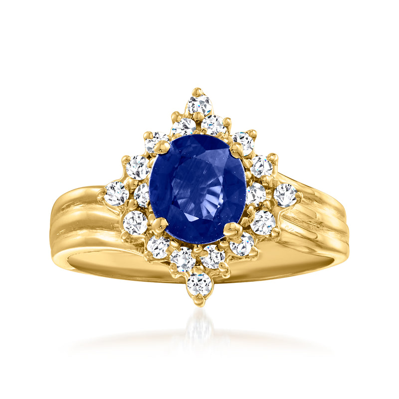 14kt yellow gold ring with oval blue sapphire center and diamond halo