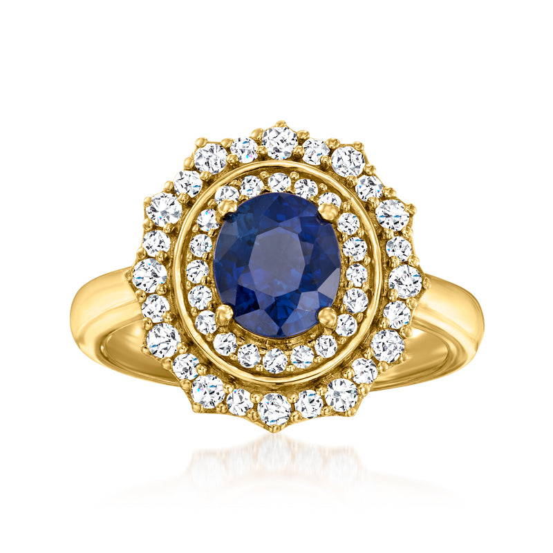 18kt yellow gold ring with oval blue sapphire center and diamond halo, prong-set