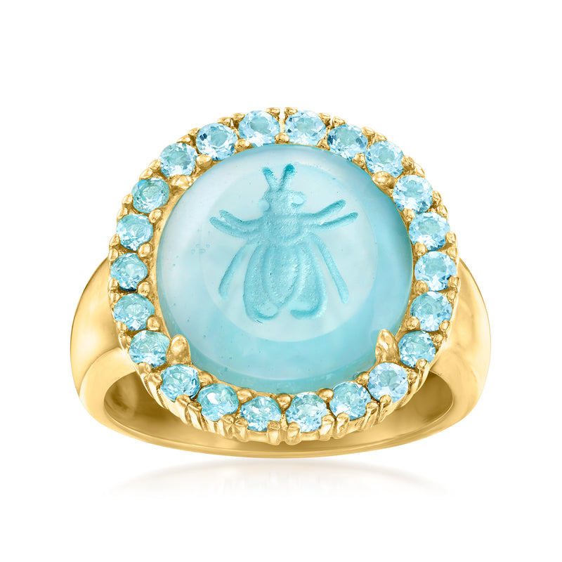 Gold ring with round sky-blue cameo surrounded by light blue stone halo