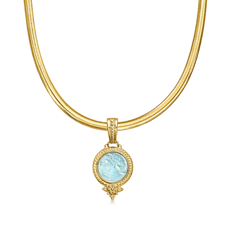 Gold chain pendant necklace with blue cameo glass medallion and ornate drop