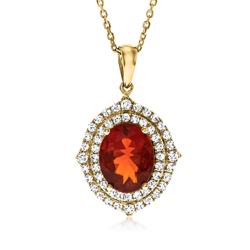 14kt yellow gold pendant necklace with oval red-orange gemstone and diamond halo