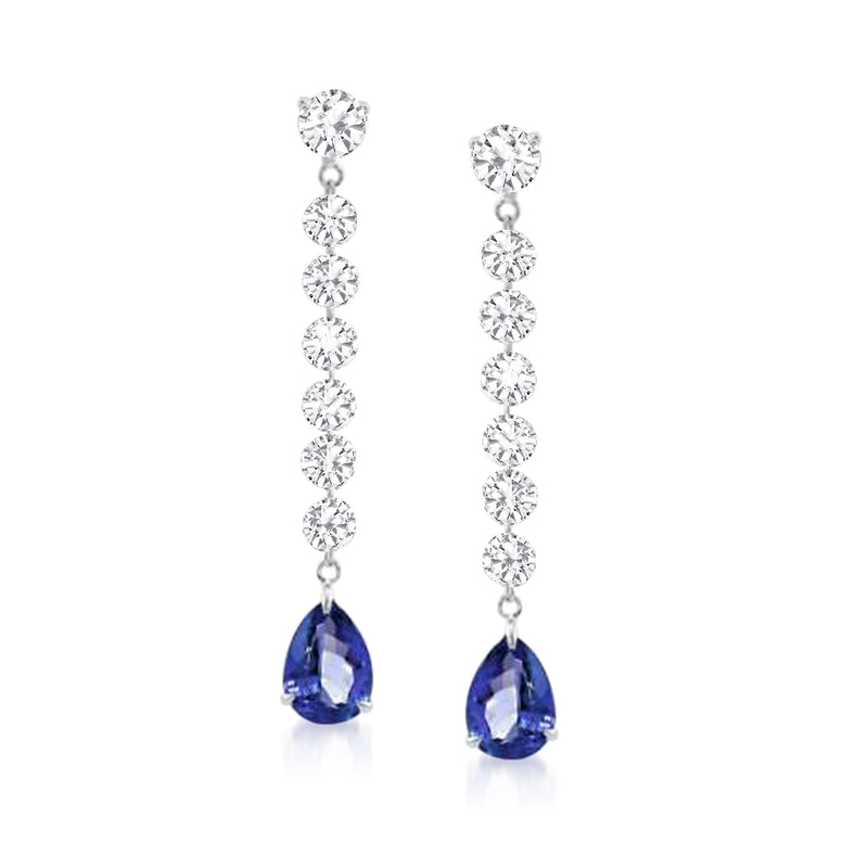 White gold linear drop earrings with diamond-like stones and blue pear-shaped gemstones