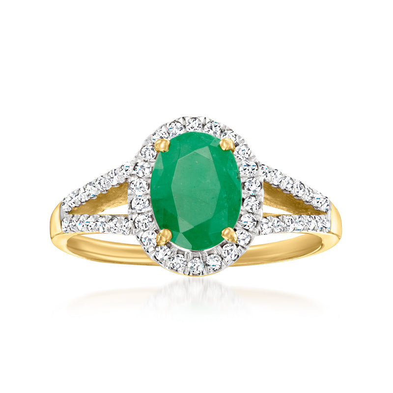 Oval emerald and diamond ring in 14kt yellow gold with halo setting