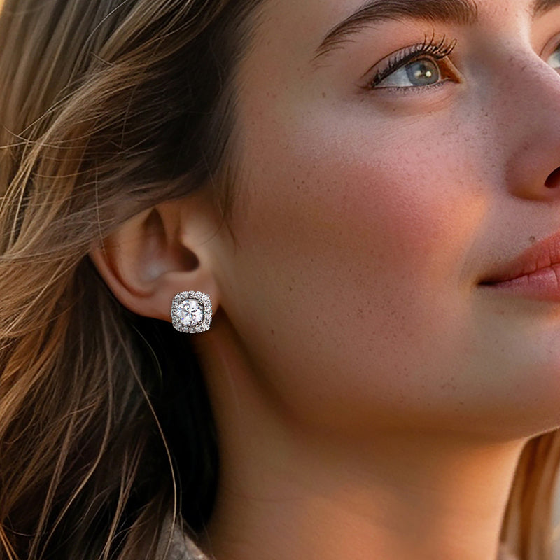 Diamond earring jackets in white gold with square halos, worn on ear