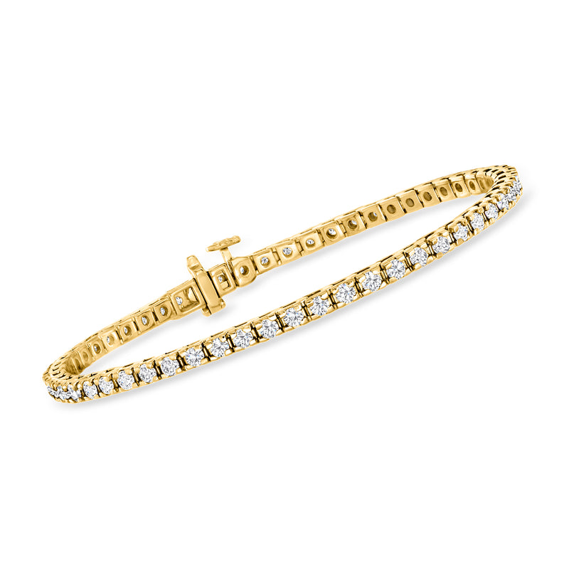 Gold tennis bracelet with round diamond-like stones in a continuous row