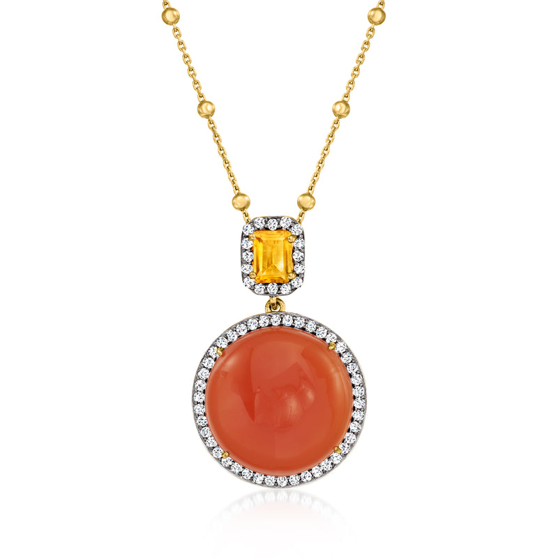 Gold-tone pendant necklace with oval orange gemstone, diamond-like halo and small accents