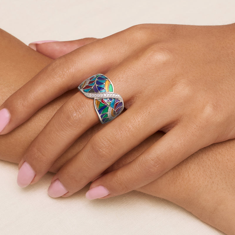 Sterling silver ring worn on hand, multicolored enamel with clear CZ stone details