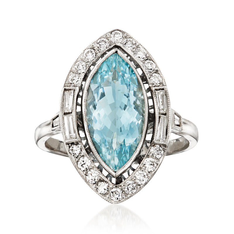 Platinum aquamarine marquise ring with diamond halo and side baguette accents