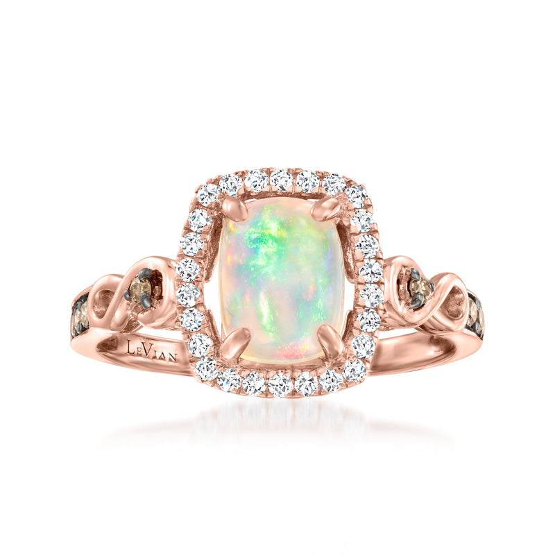 Rose gold opal ring with oval opal center and diamond halo, with side stone accents