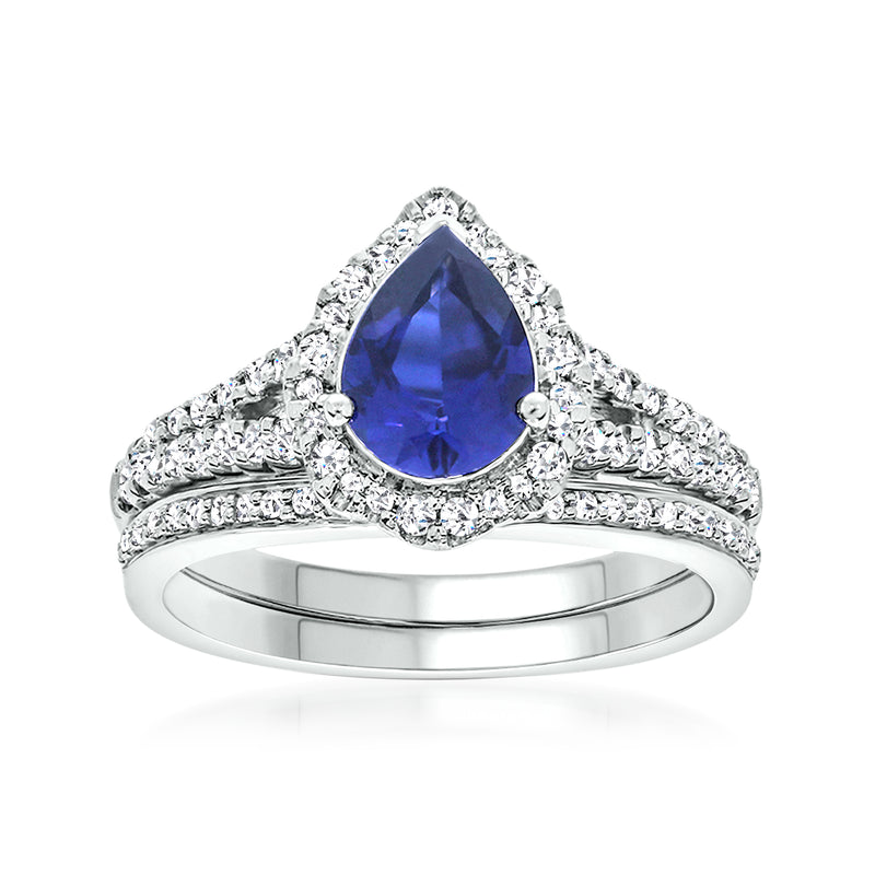 White gold sapphire and diamond ring set with pear-cut blue center stone