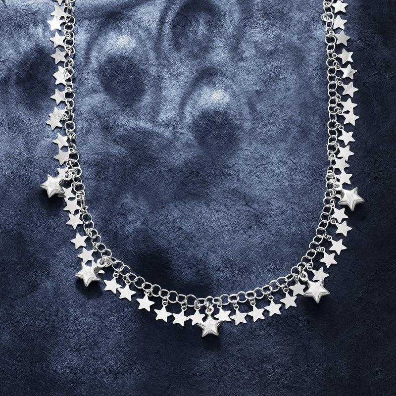 Sterling silver star drop necklace with multiple dangling star charms on a chain