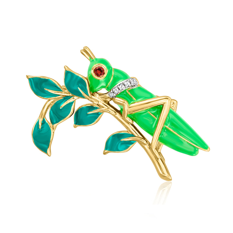 Green enamel grasshopper pin with gold details, white stones, and a red accent