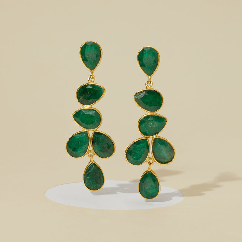 Emerald drop earrings featuring green teardrop stones in gold over sterling links