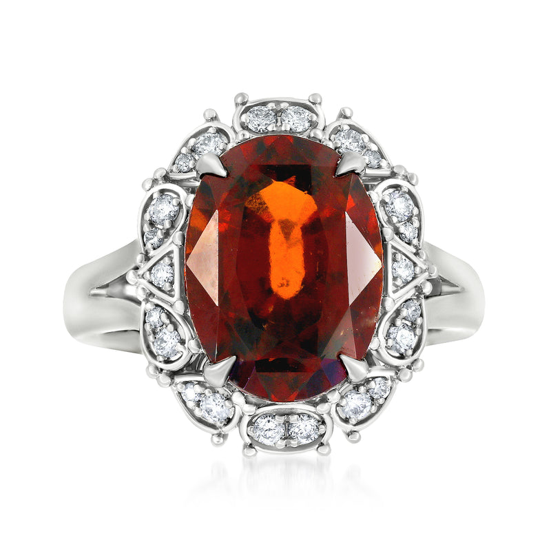 18kt white gold ring with oval hessonite garnet center and diamond halo