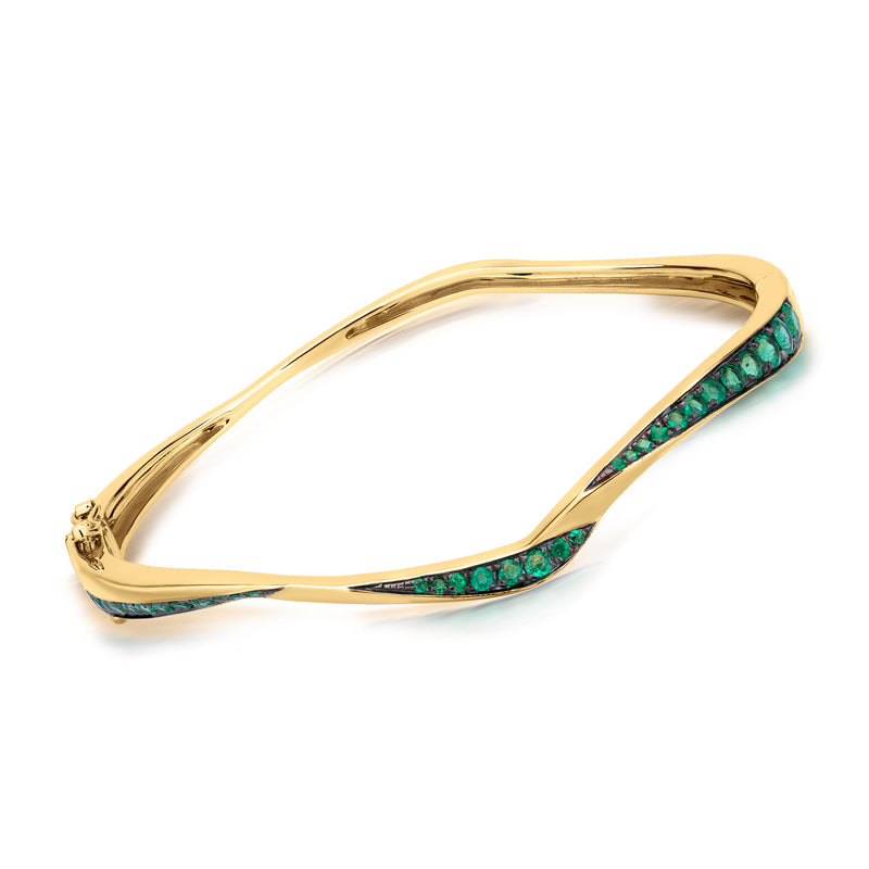 18k yellow gold wavy bangle bracelet with green emerald crystal inlay