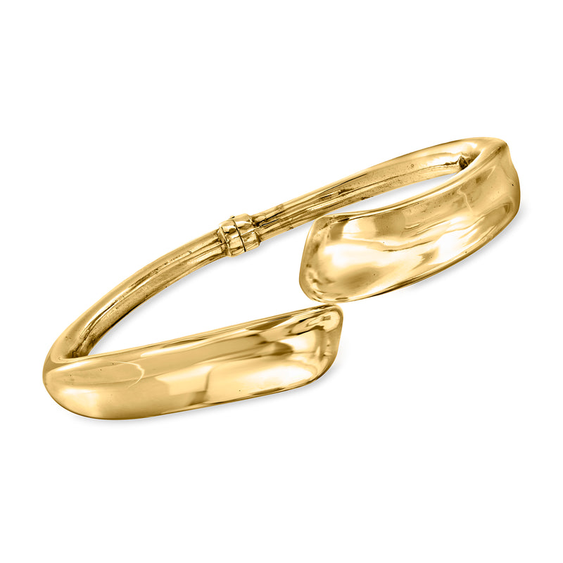 Yellow gold hinged cuff bracelet with concave oval profile