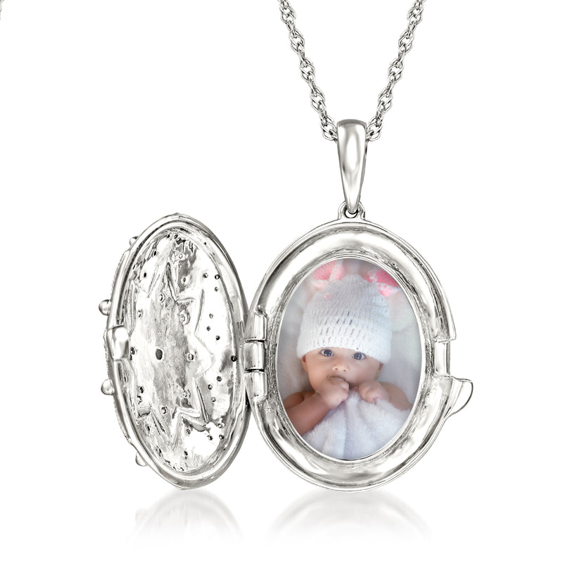 Sterling silver open locket necklace with oval photo glass and baby face visible