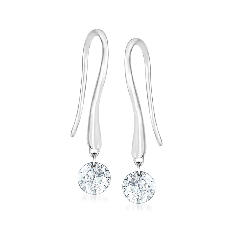 Diamond drop earrings in 18kt white gold with round dangling stone on earwires.