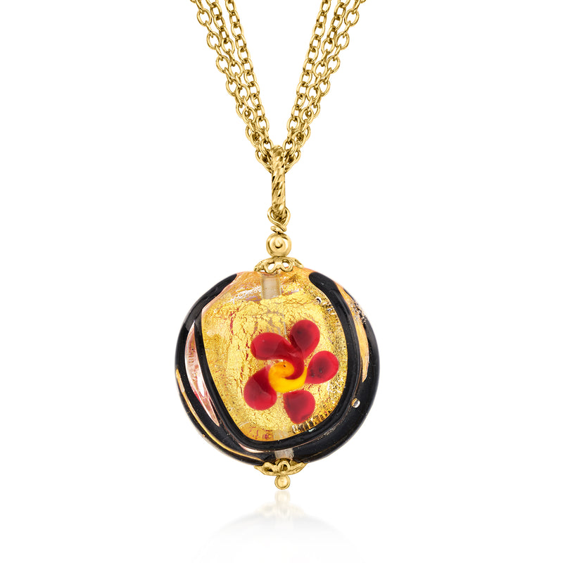 Gold-tone chain necklace with round multicolor floral pendant in black and amber glass