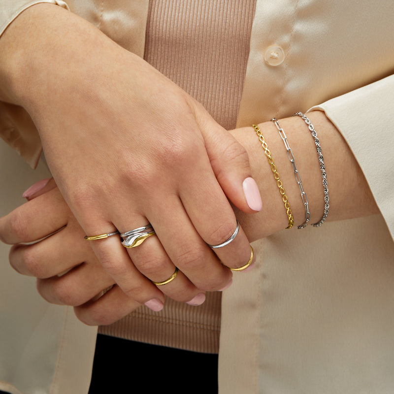 Sterling silver link bracelets stacked on wrist with clasp