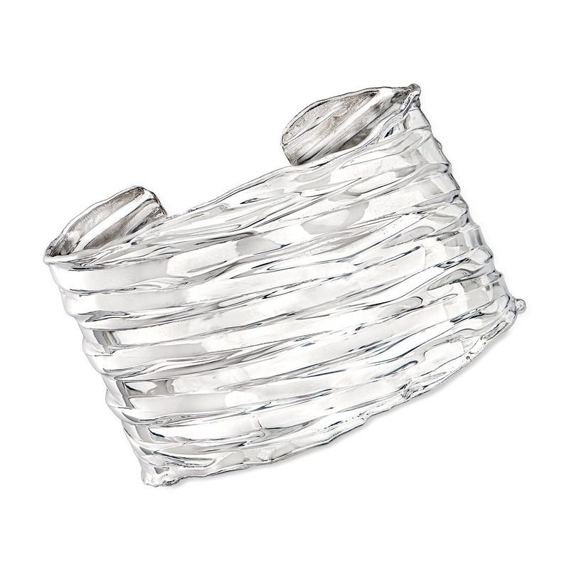 Wide sterling silver cuff bracelet with textured ridged and polished finish