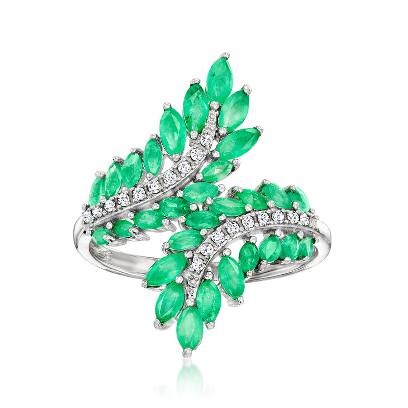 Sterling silver bypass ring with green oval gemstones and sparkling white diamond accents