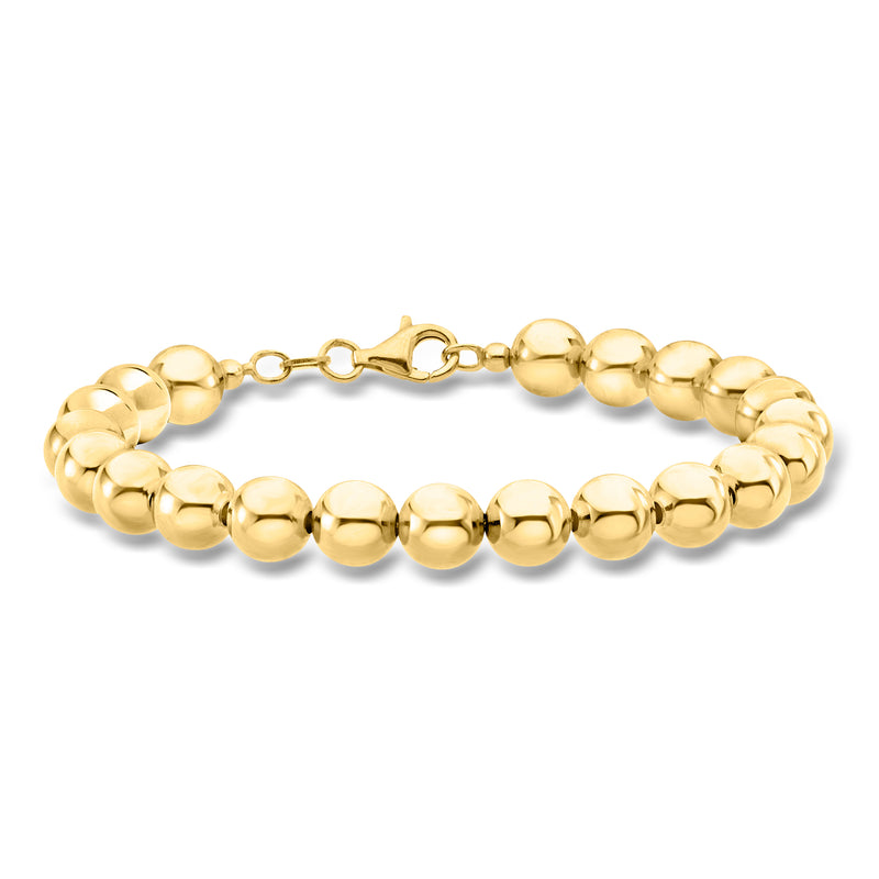 Bead bracelet with round gold-tone balls and toggle clasp