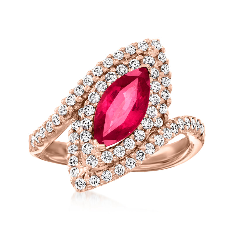 14k rose gold cocktail ring with pear-cut ruby center and diamond halo