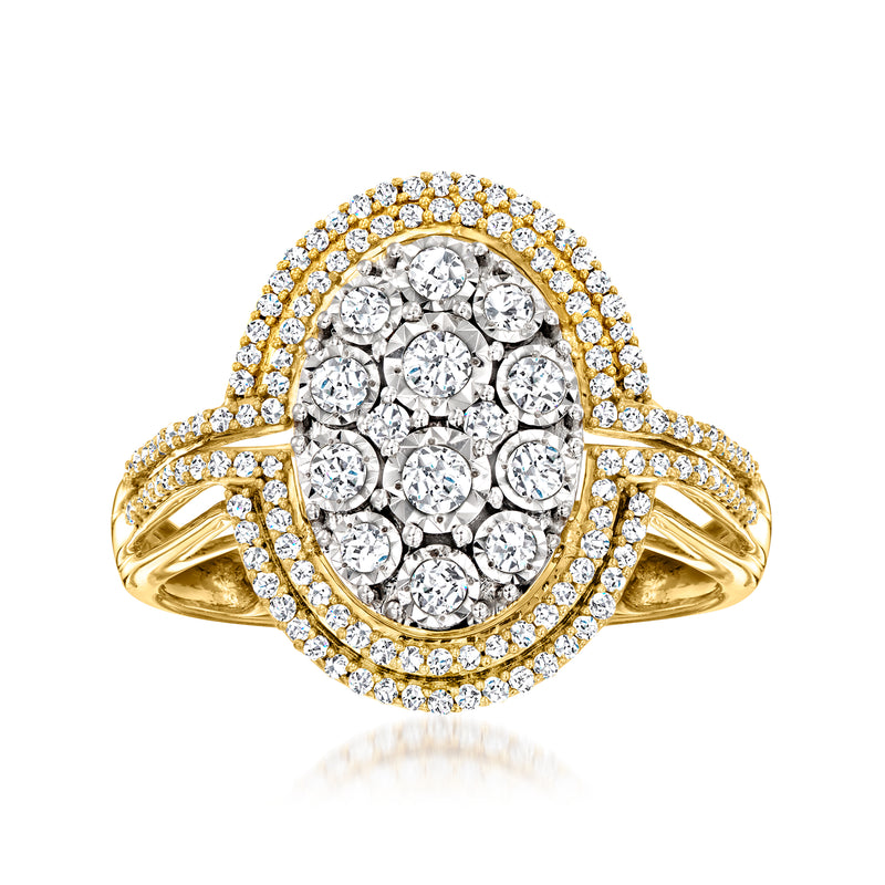 Oval diamond cluster ring with gold band and halo of round stones
