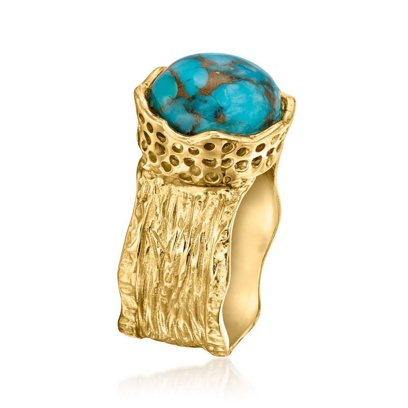 Gold-tone wide ring with oval turquoise cabochon and textured bezel