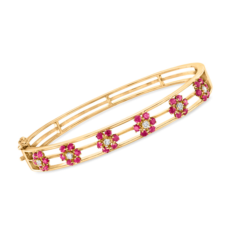 14kt yellow gold bangle bracelet with ruby flower cluster accents