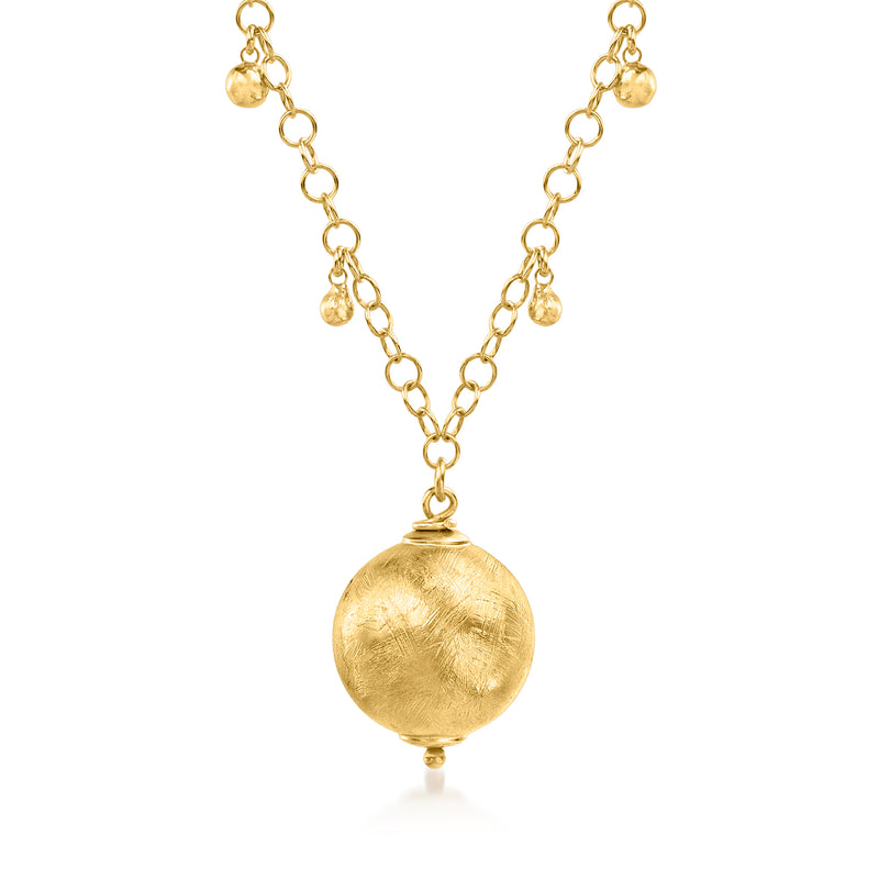 Gold-tone beaded station necklace with round hammered pendant, polished chain links