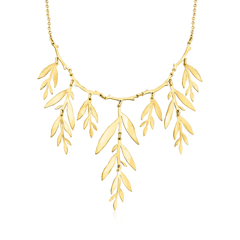 Gold over sterling leaf branch necklace with dangling leaf charms on a chain