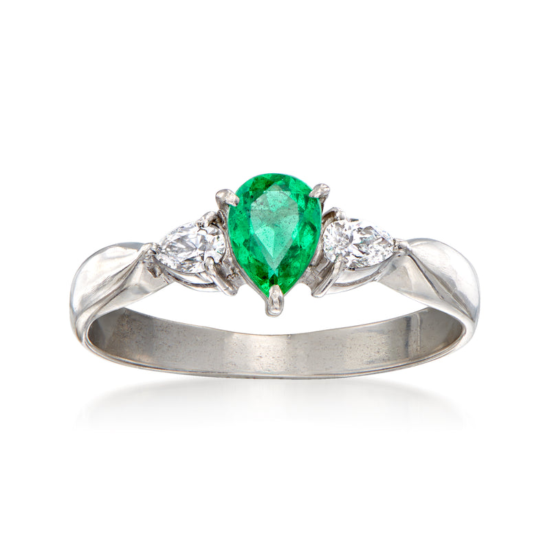 Vintage platinum ring with pear-cut green emerald and diamond side stones