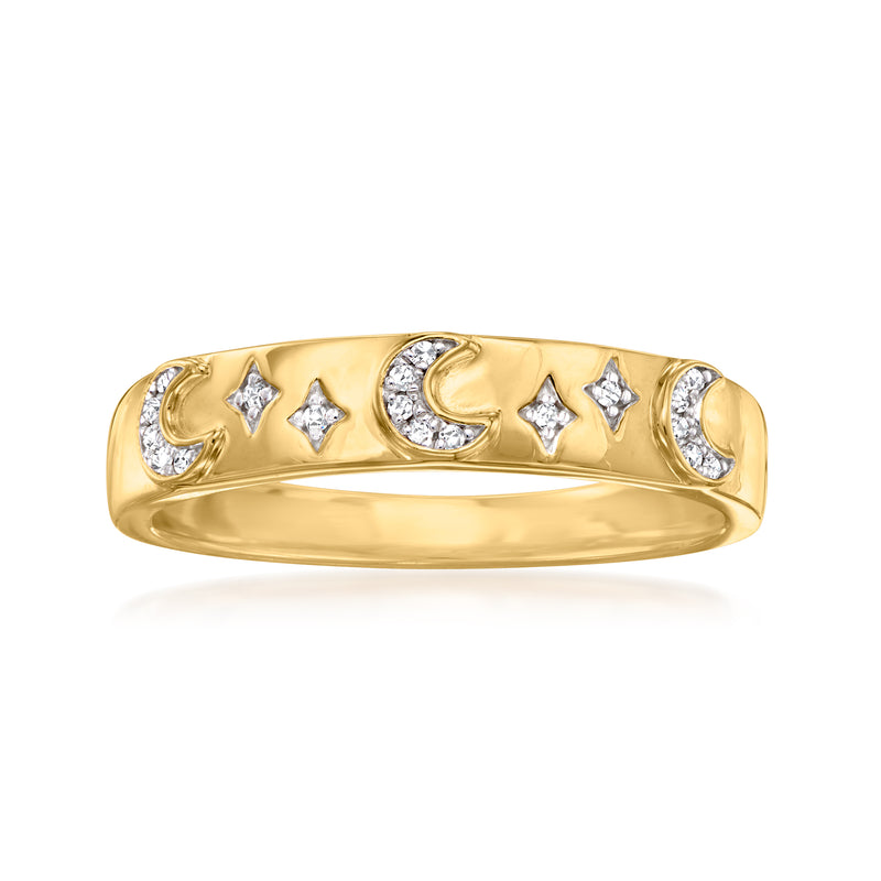 Gold-tone ring with moon-and-star motifs and crystal-like stones on a polished band